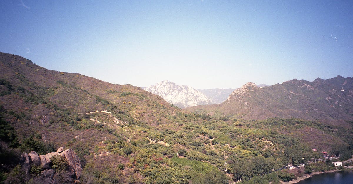 How to disable film grain in Silent Hill 2 on PS2? - Rough mountainous terrain with calm lake