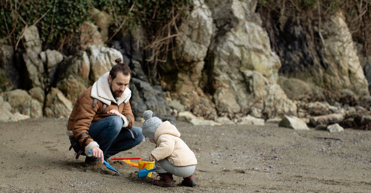 How to disable play time tracking? - Father and kid playing with toys on sandy beach