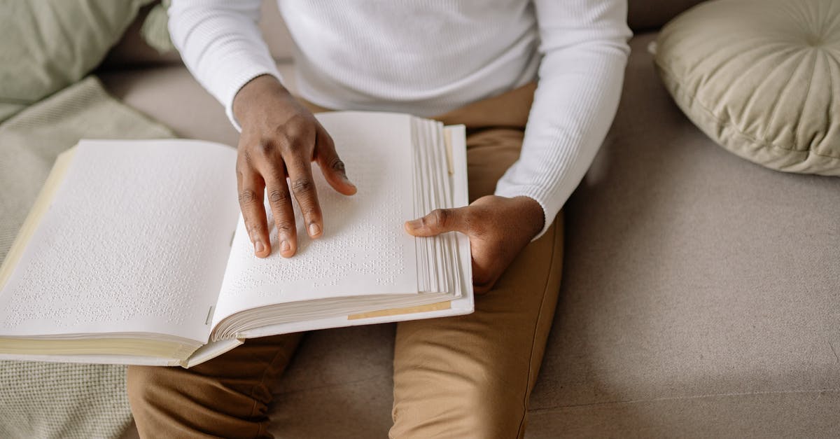 How to do damage if touching a particle? - A Person Sitting on Gray Couch Holding Braille Book How to do damage if touching a particle? - A Person Sitting on Gray Couch Holding Braille Book
