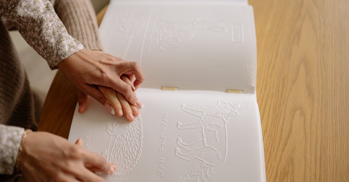 How to do damage if touching a particle? - A Person Assisting a Child Read a Braille Book How to do damage if touching a particle? - A Person Assisting a Child Read a Braille Book