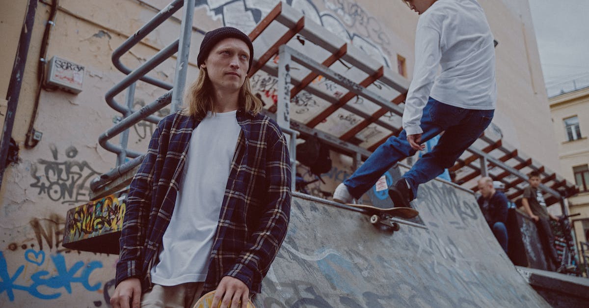 How to do emote tricks on a Tumbler? - Man in White Long Sleeve Shirt Standing Beside Woman in Blue and White Plaid Dress Shirt