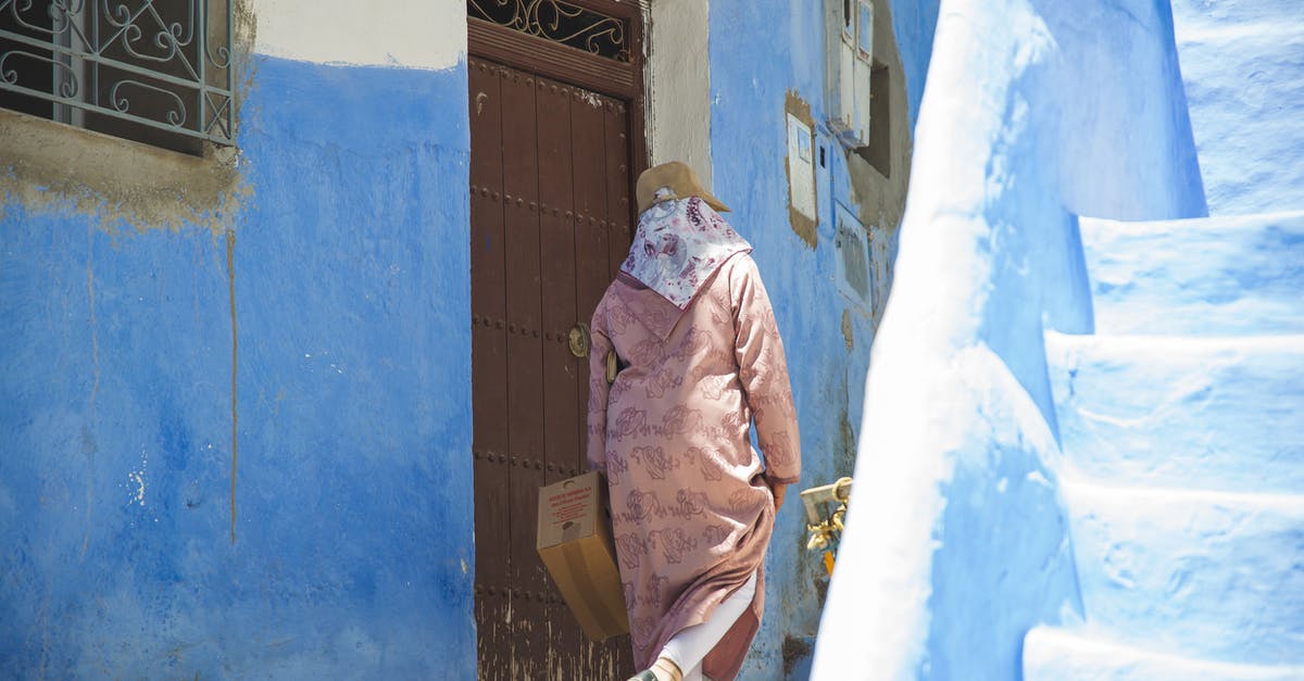 How to do one step back in a quest "Molecular Level"? - Unrecognizable person walking near old building