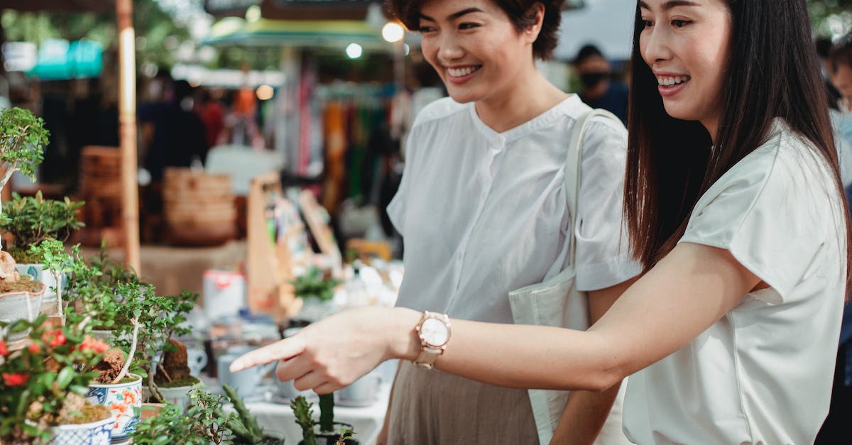 How to earn Monster Summer Sale cards? [duplicate] - Crop happy Asian women choosing houseplants in market