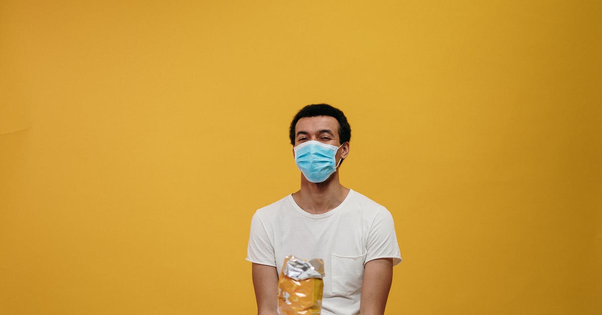 How to eat a virus without being split? - Man in White Crew Neck T-shirt Sitting by the Table How to eat a virus without being split? - Man in White Crew Neck T-shirt Sitting by the Table