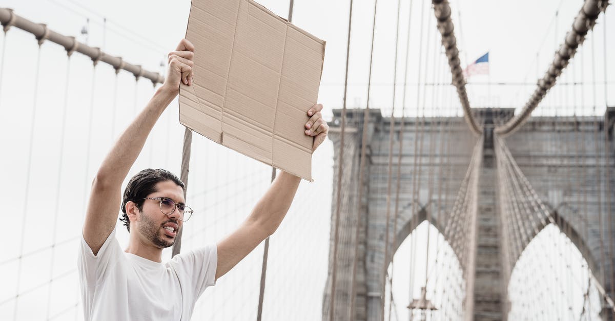 How to enable the bribing of democracies - A Man with a Blank Placard Raised above His Head