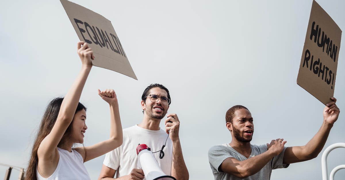 How to enable the bribing of democracies - Man in White Polo Shirt Holding White Paper