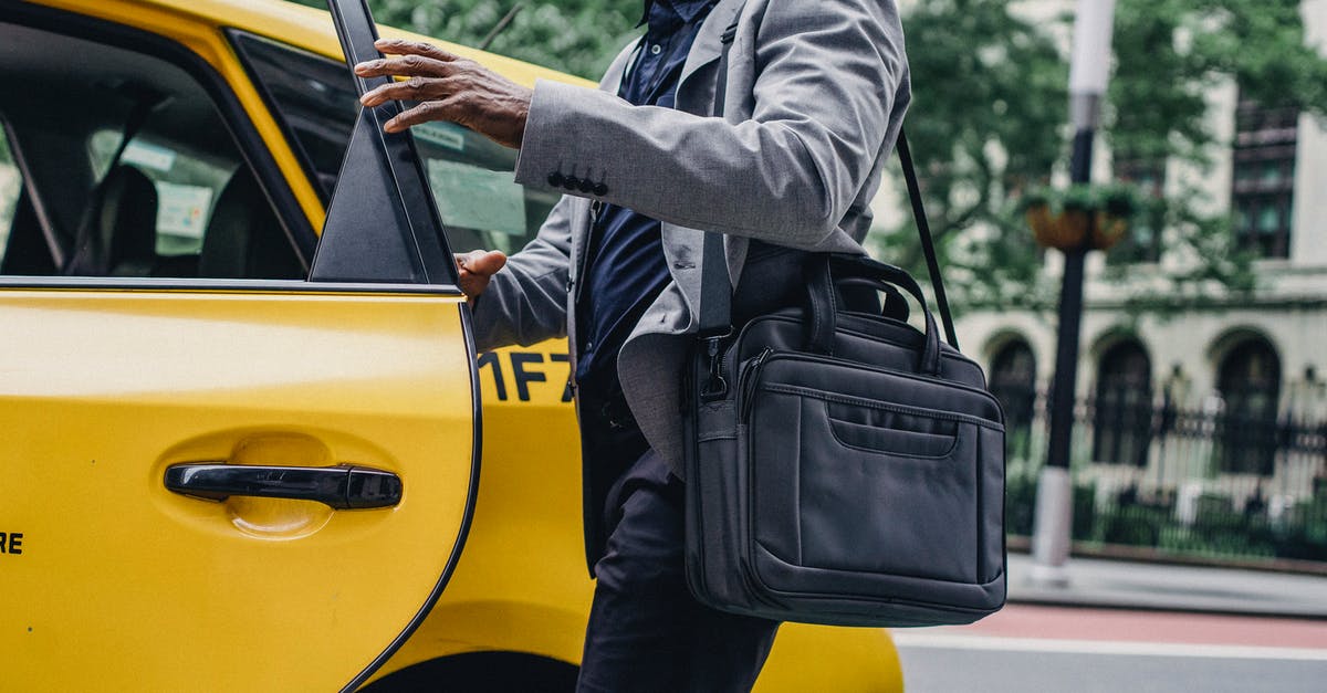 How to enter Nethack Quest if Quest Leader is killed? - Side view of crop anonymous African American male opening door of bright yellow cab on street