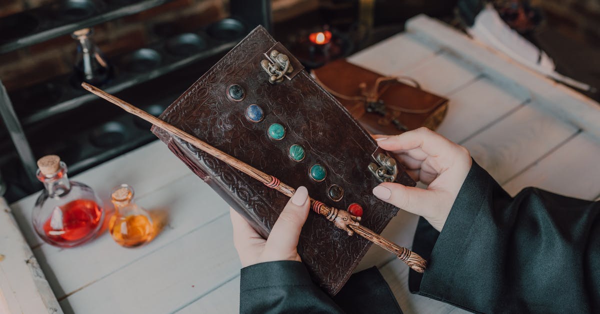 How to execute command when holding a book? - Close-Up Shot of a Person Holding a Spell Book and a Wand How to execute command when holding a book? - Close-Up Shot of a Person Holding a Spell Book and a Wand