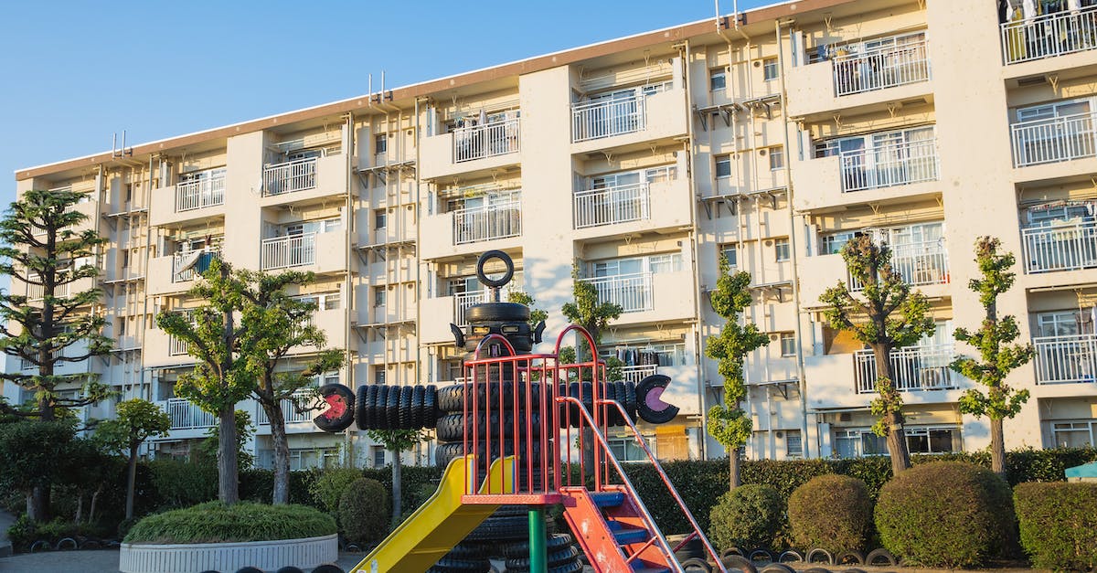 How to figure out someone's seed in Minecraft? [duplicate] - Playground in suburb yard with metal slide and huge robot made of pile of old rubber tyres