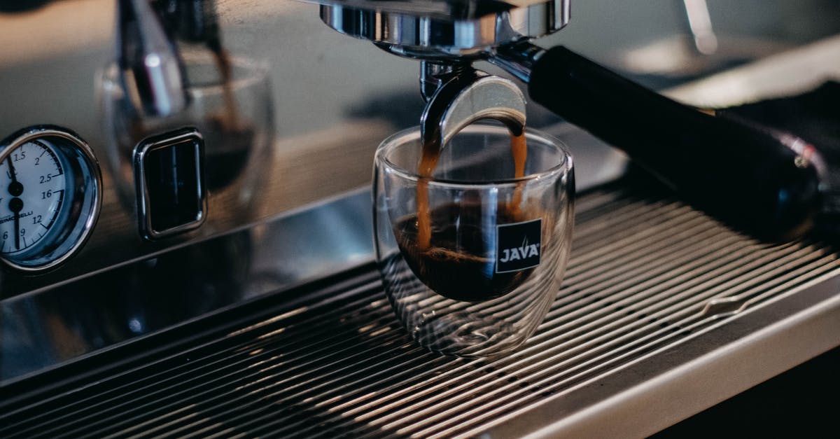 How to fill a black soul gem? [duplicate] - Modern professional coffee machine pouring freshly brewed aromatic ristretto into small glass cup in coffee shop
