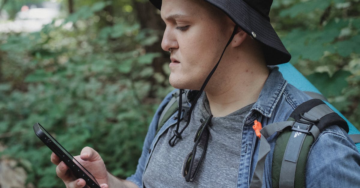 How to fix location error using Win10 Edge to surf ingress.com/intel? - Focused young male backpacker checking location on smartphone in nature