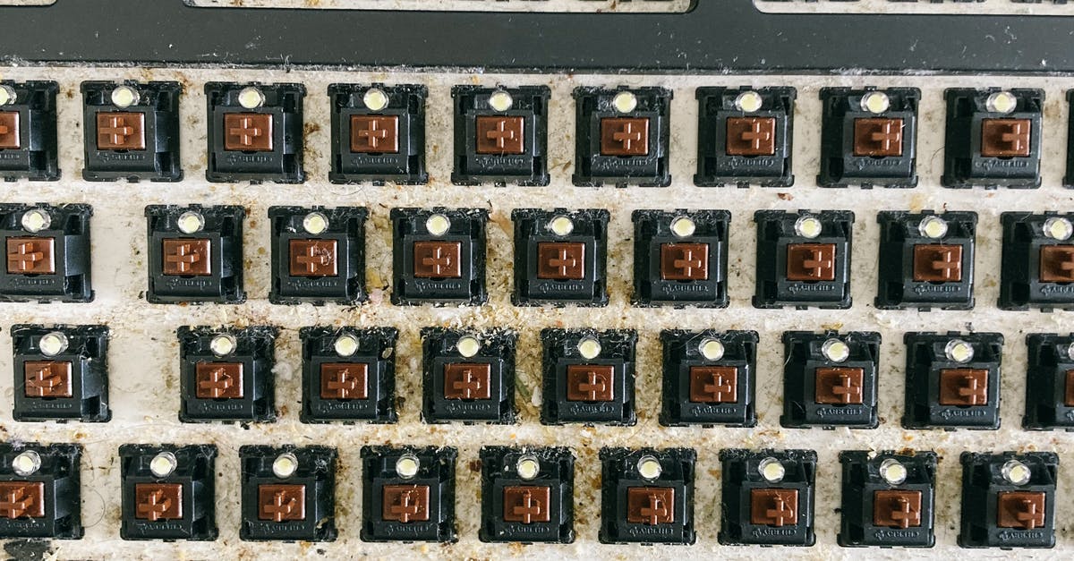 How to fix Minecraft not reacting to pressed scroll button? - From above of keyboard panel without keycaps full of dust and dirt before cleaning