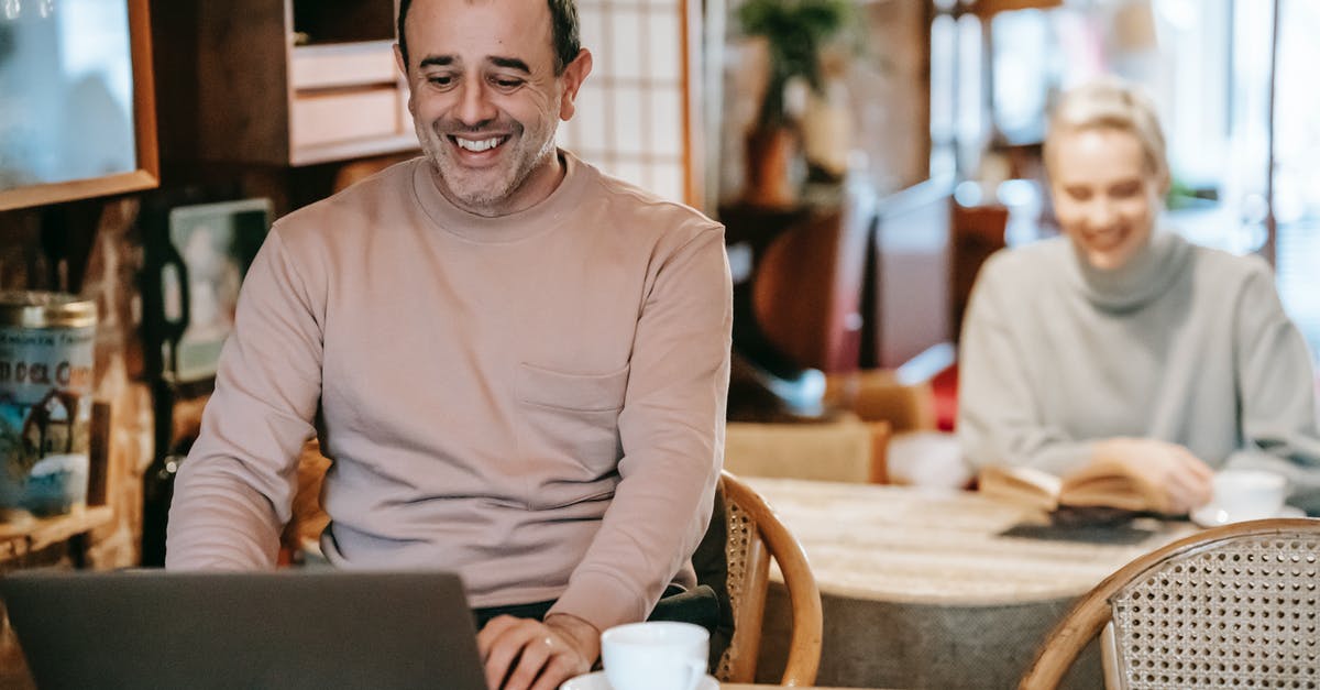 How to fix screen resolution in Minecraft Story Mode? - Cheerful middle aged ethnic man smiling while working remotely on laptop near positive wife reading book and drinking coffee How to fix screen resolution in Minecraft Story Mode? - Cheerful middle aged ethnic man smiling while working remotely on laptop near positive wife reading book and drinking coffee