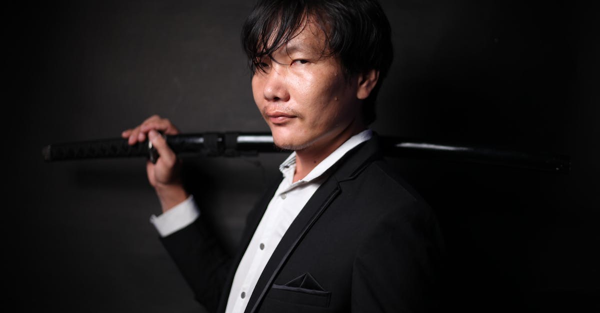 How to force Sudden-Death Overtime gang to appear? - Brutal ethnic male with dark short hair and sharp heavy katana in black formal jacket in studio How to force Sudden-Death Overtime gang to appear? - Brutal ethnic male with dark short hair and sharp heavy katana in black formal jacket in studio