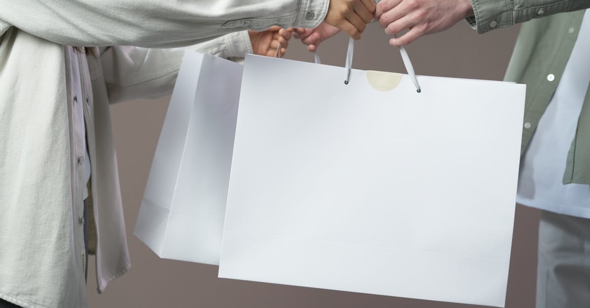 How to gank as a Mid laner - Person in Gray Long Sleeve Shirt Holding White Paper