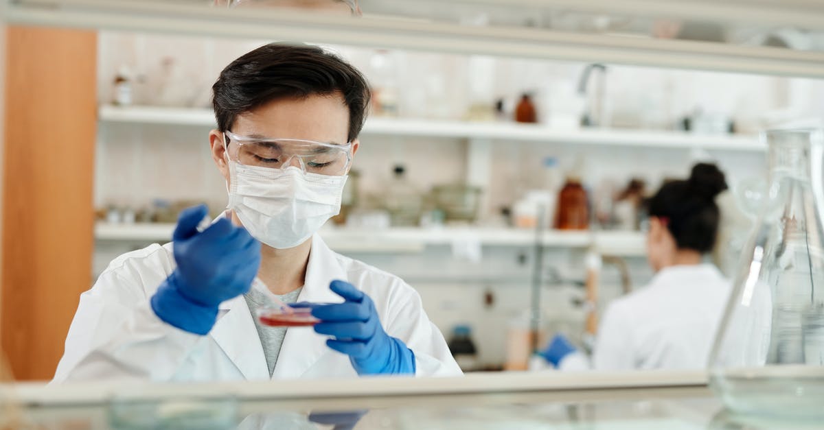How to get a scientist with Psionics expertise? - Man Doing A Sample Test In The Laboratory