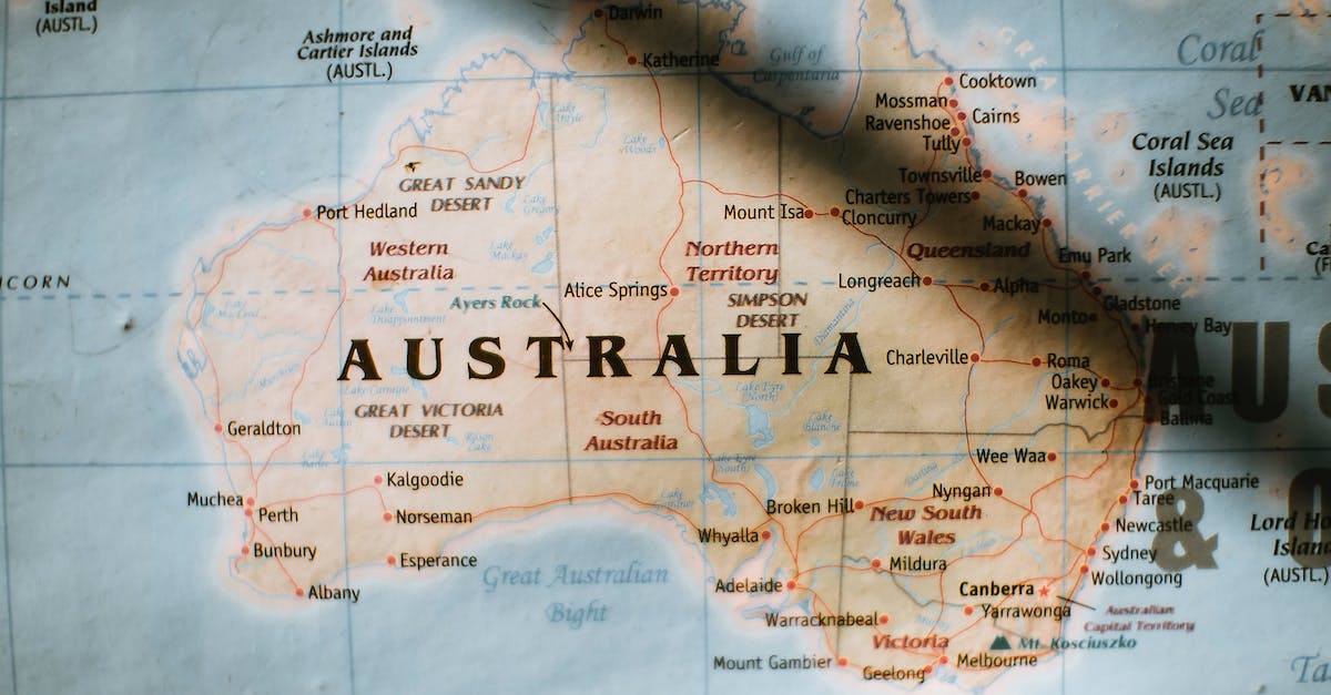 How to get a slowly expanding world border in Minecraft? - Closeup of political map of Australia with cities and regions with borders surrounded by seas and oceans placed on wall in sunny room