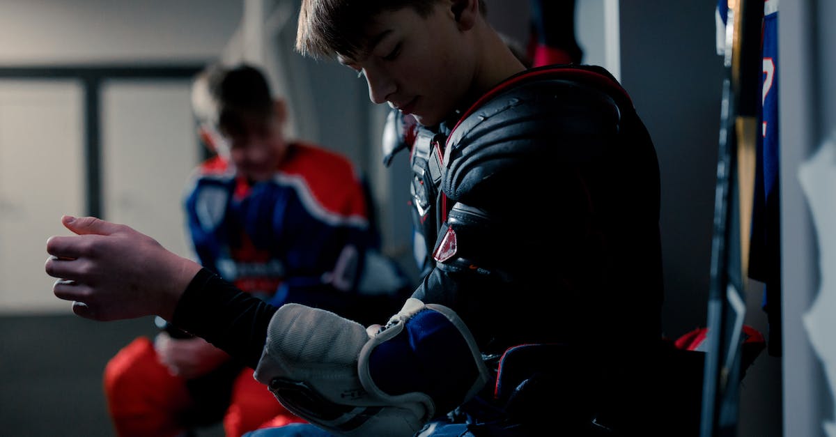 How to get another player ID for Farmville 2 Country Escape? - A Boy in the Locker Room Putting on Protective Gears