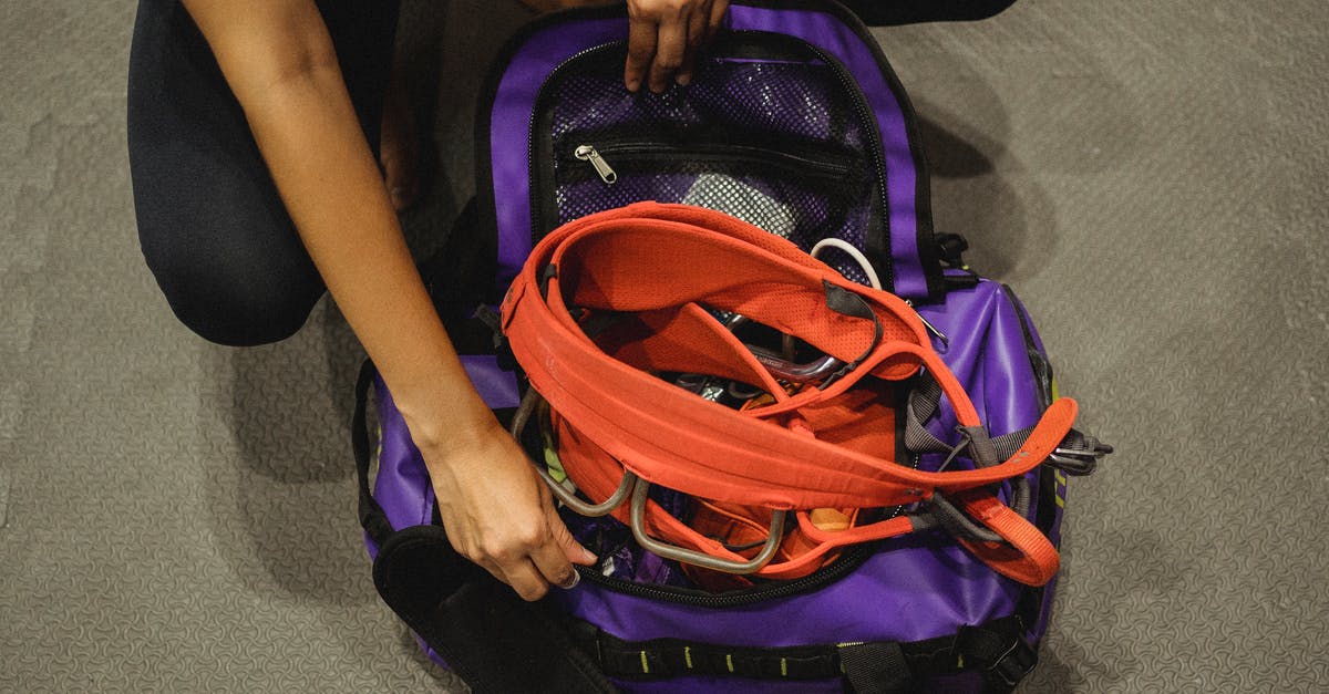 How to get double loot and XP from a Pokestop? - Crop woman getting safety equipment from violet bag How to get double loot and XP from a Pokestop? - Crop woman getting safety equipment from violet bag
