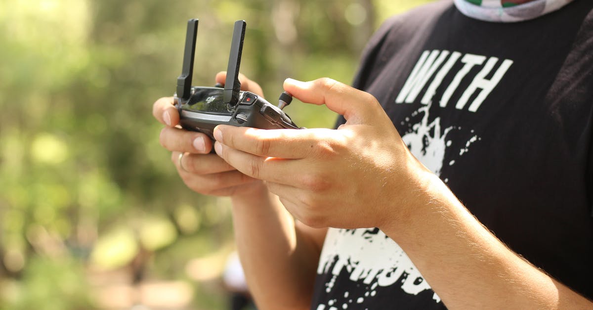 How to get in touch with World of Warcraft narrative without playing the game? - Person Holding Radio Controller at Daytime