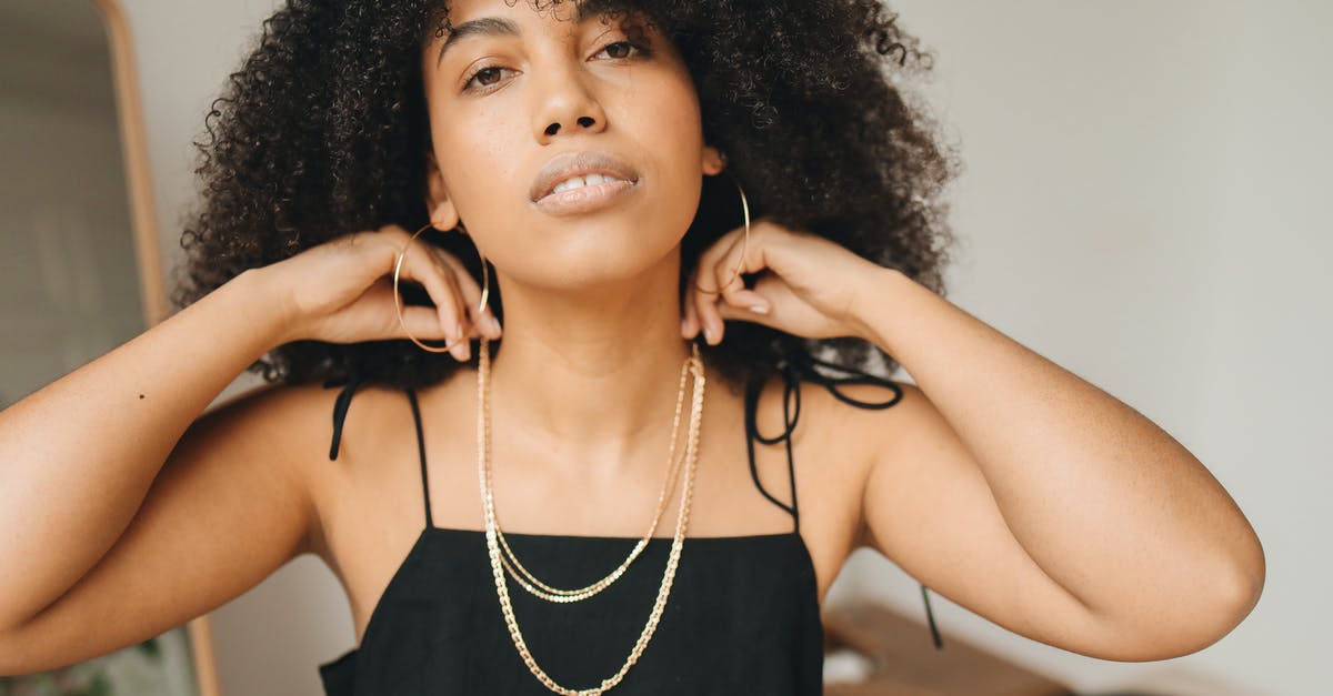 How to get more gold after Khrumbul-dun? - Woman in Black Spaghetti Strap Top Wearing Necklace