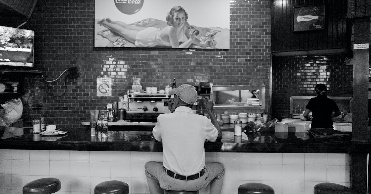 How to get my hat back on? - Back of a Man Sitting at the Bar