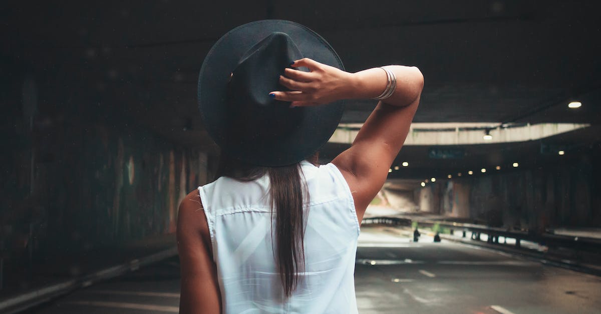 How to get my hat back on? - Photo of Woman Wearing Fedora