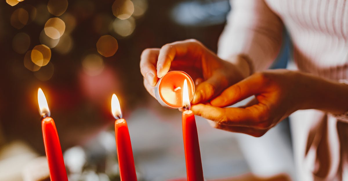 How to get off of Lighting Stance? - Woman Lighting Candles during Christmas