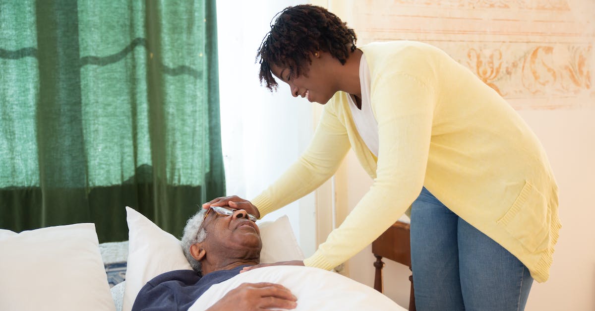 How to get rid of bed head - Woman Touching Elderly Mans Head How to get rid of bed head - Woman Touching Elderly Mans Head