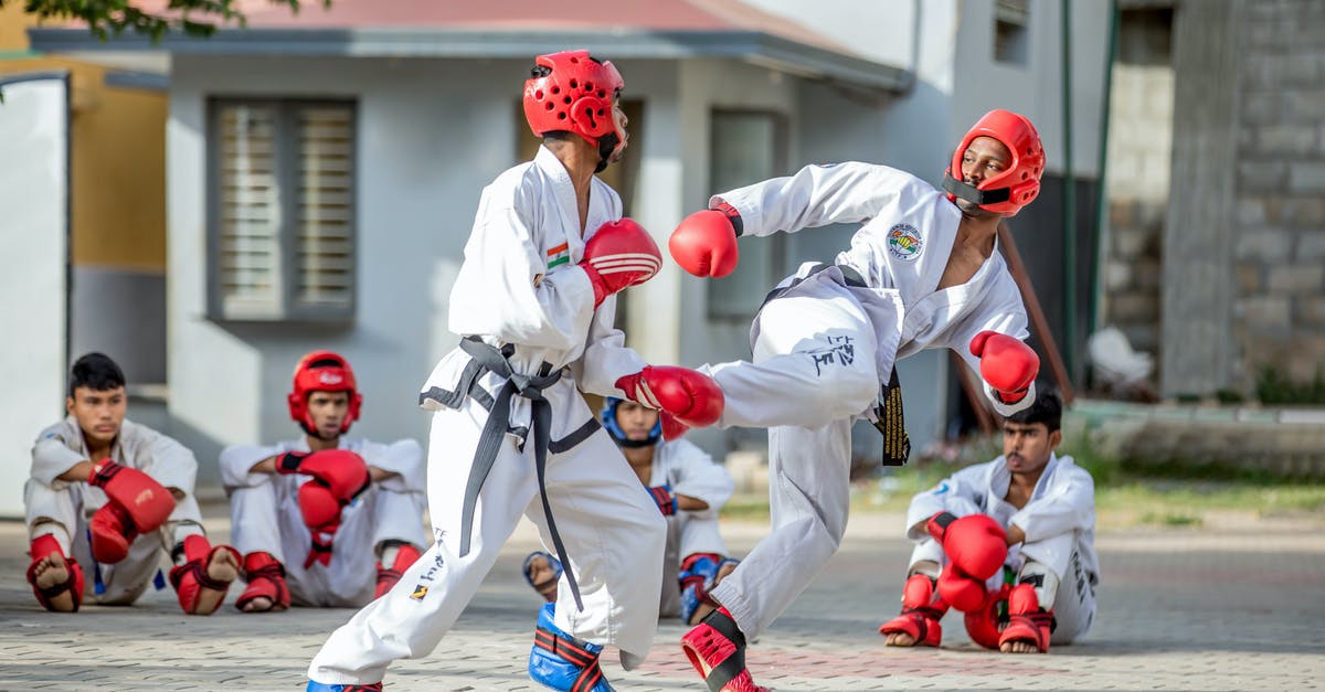 How to get the dragon to fight me - Men in White Karate Gi and Red Helmet Playing on Street