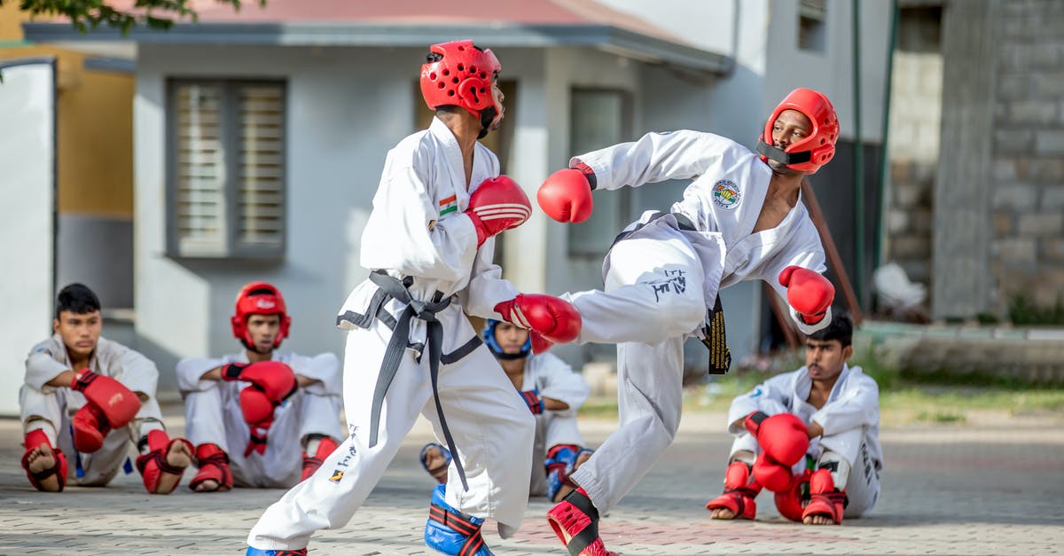 How to get the dragon to fight me - Men in White Karate Gi and Red Helmet Playing on Street How to get the dragon to fight me - Men in White Karate Gi and Red Helmet Playing on Street