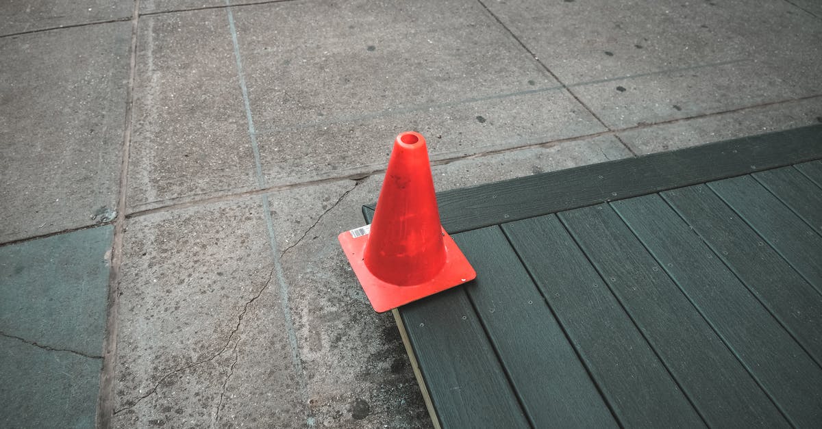 How to get to this quest marker in Witcher 3? - Red Plastic Traffic Cone on Gray Concrete Floor