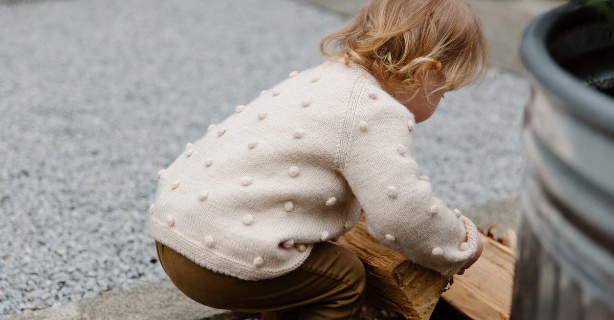 How to increase Oil Well Generation in Build Craft? - Unrecognizable kid playing with firewood in garden