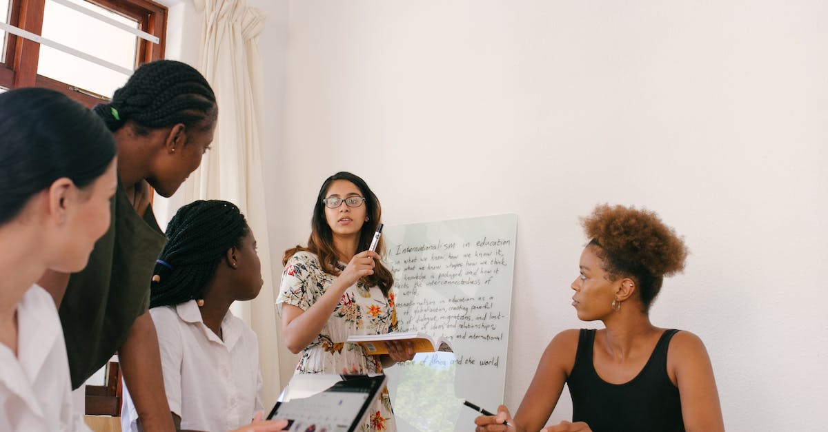 How to increase team rating in Fifa 15 Ipad game? - Woman Discussing in Front of Other Women How to increase team rating in Fifa 15 Ipad game? - Woman Discussing in Front of Other Women