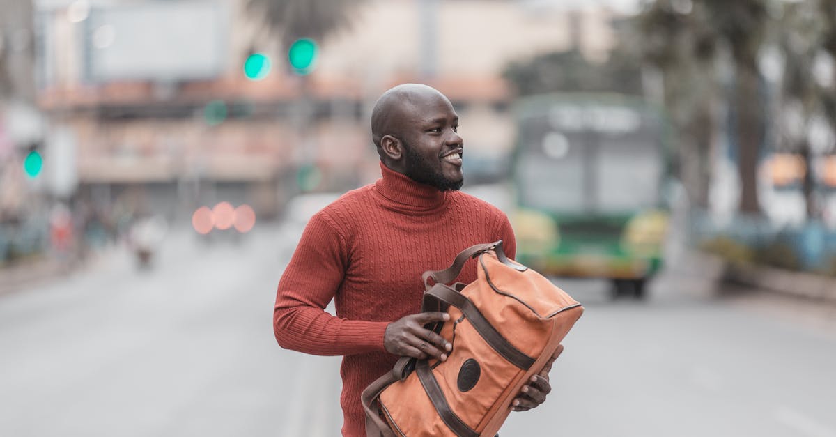How to increase the bus density? - Man in Red Sweater Carrying Brown Leather Backpack