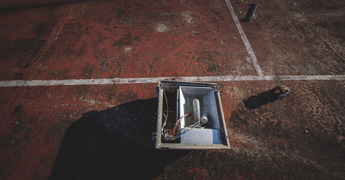How to install a Windows game for steam? - From above of outdoor lamp box placed on rough dirty ground of sports court on sunny day