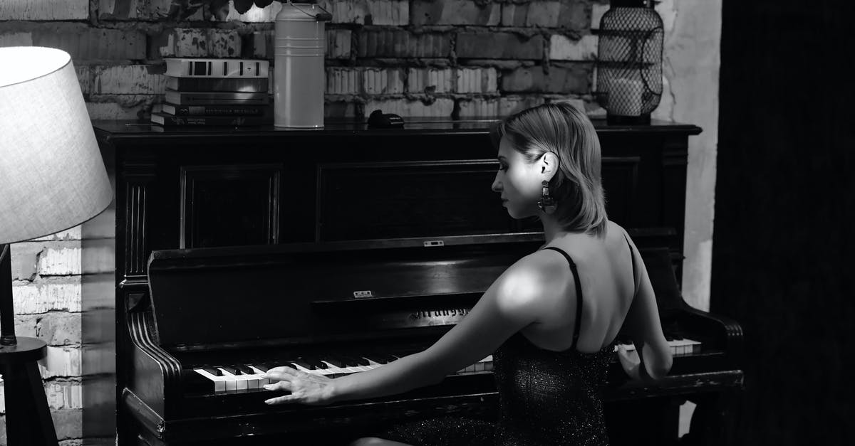How to kill a player when they touch a block? - Black and white side view of focused female playing piano while rehearsing in room at brick wall near vase with flowers How to kill a player when they touch a block? - Black and white side view of focused female playing piano while rehearsing in room at brick wall near vase with flowers
