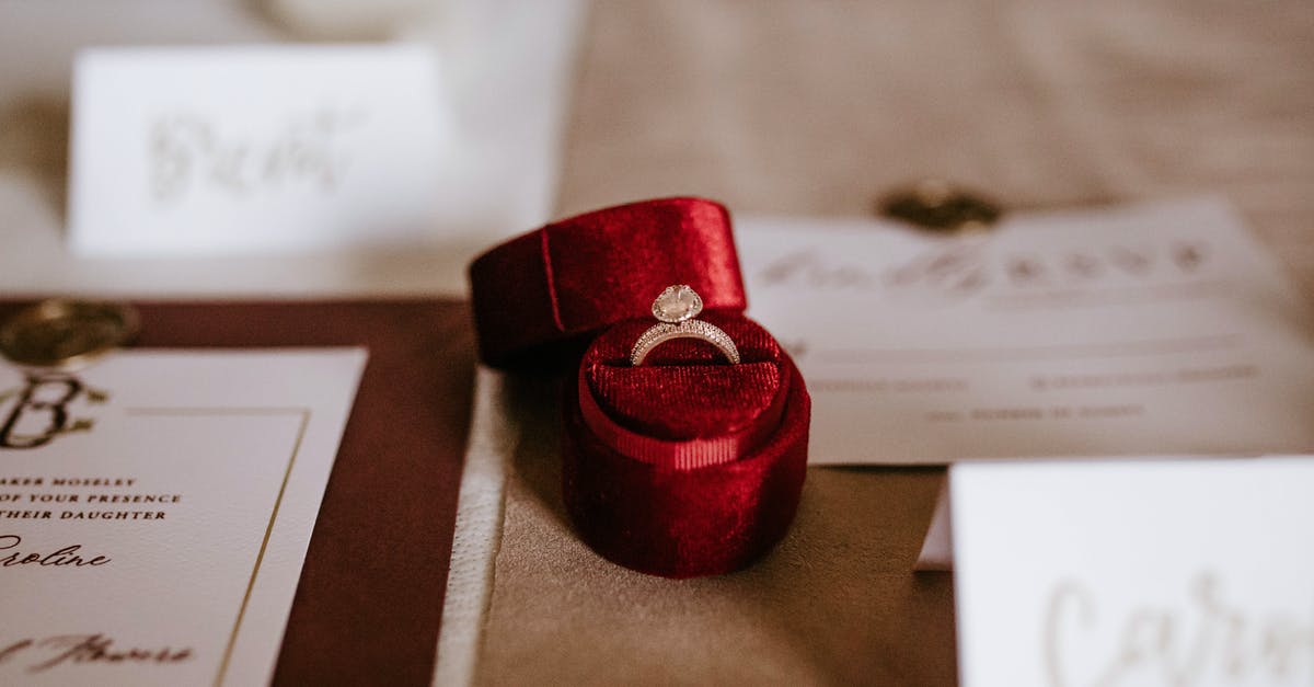 How to know which ceremony to select (5 possible options)? - Red box with golden ring placed on table with invitation cards