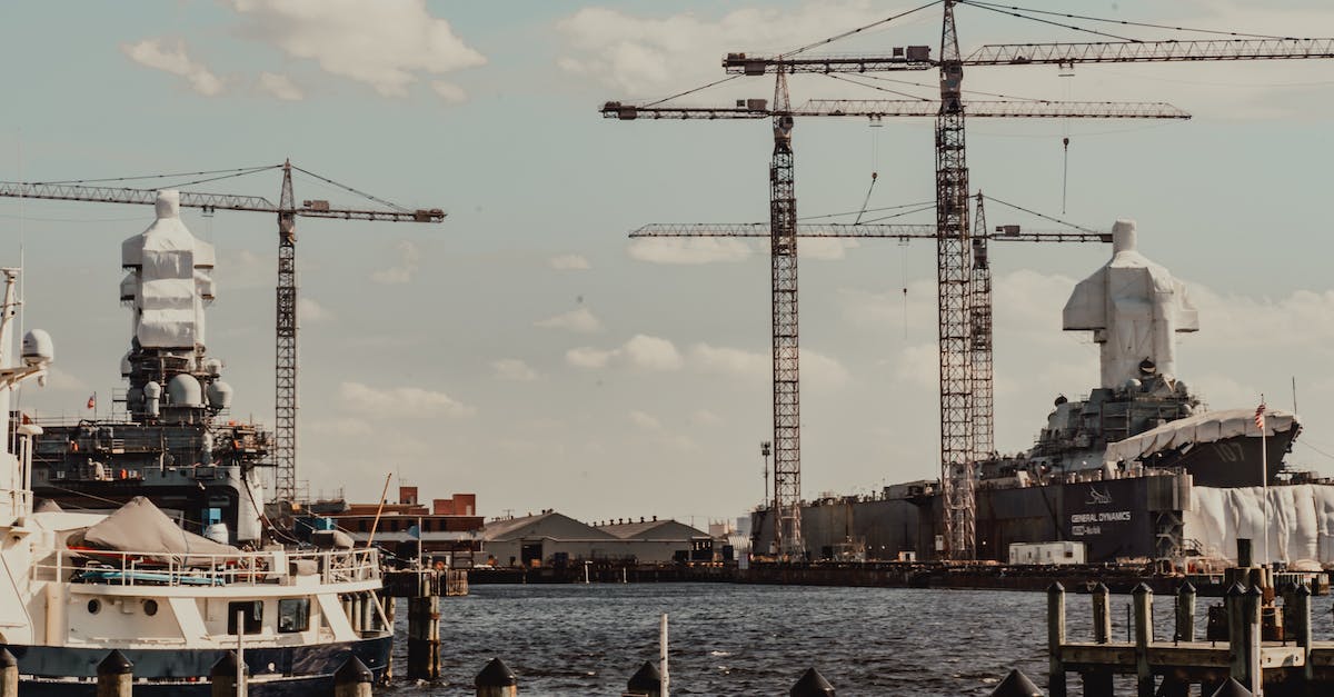 How to load the Nether of a Bukkit-powered server into MCEdit? - Contemporary industrial cargo port with tall weightlifting cranes and moored modern vessels near pier on clear weather