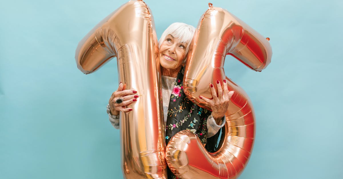 How to make a big holographic number? - A Happy Elderly Woman Celebrating Her Birthday while Holding a Huge Balloon Numbers