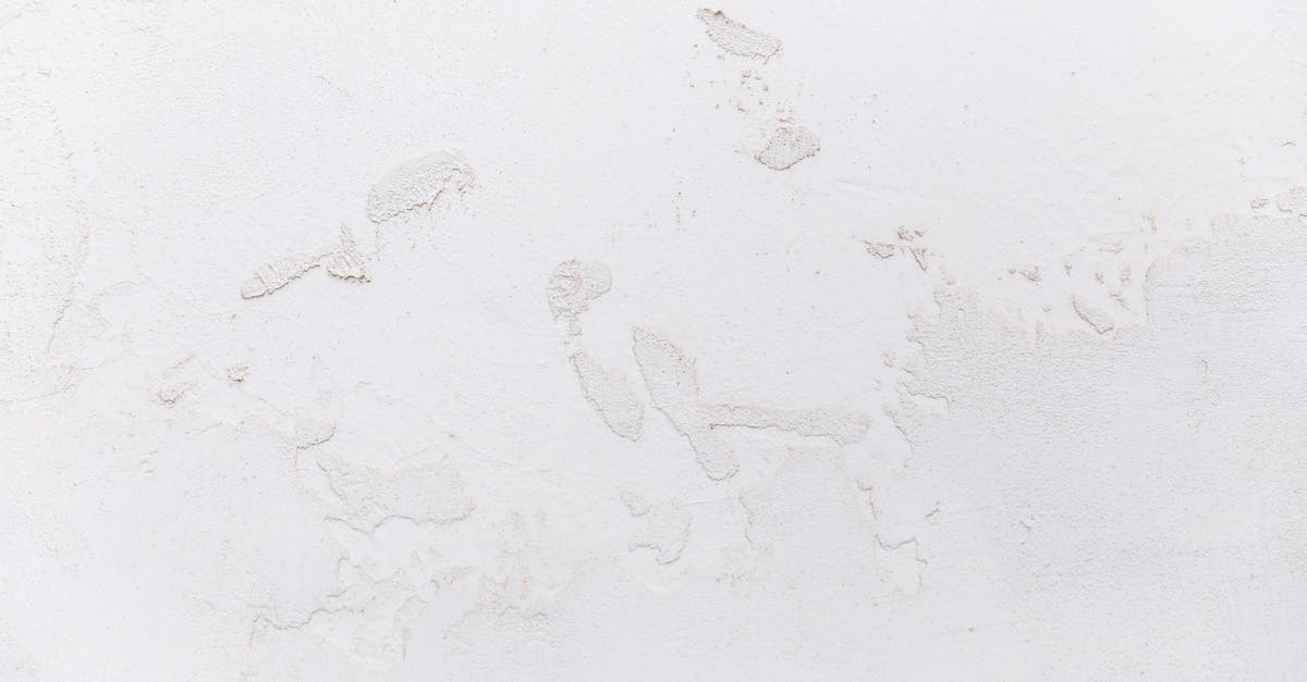 How to make a command block say something only once in Minecraft? - White shabby concrete wall with cracked stucco
