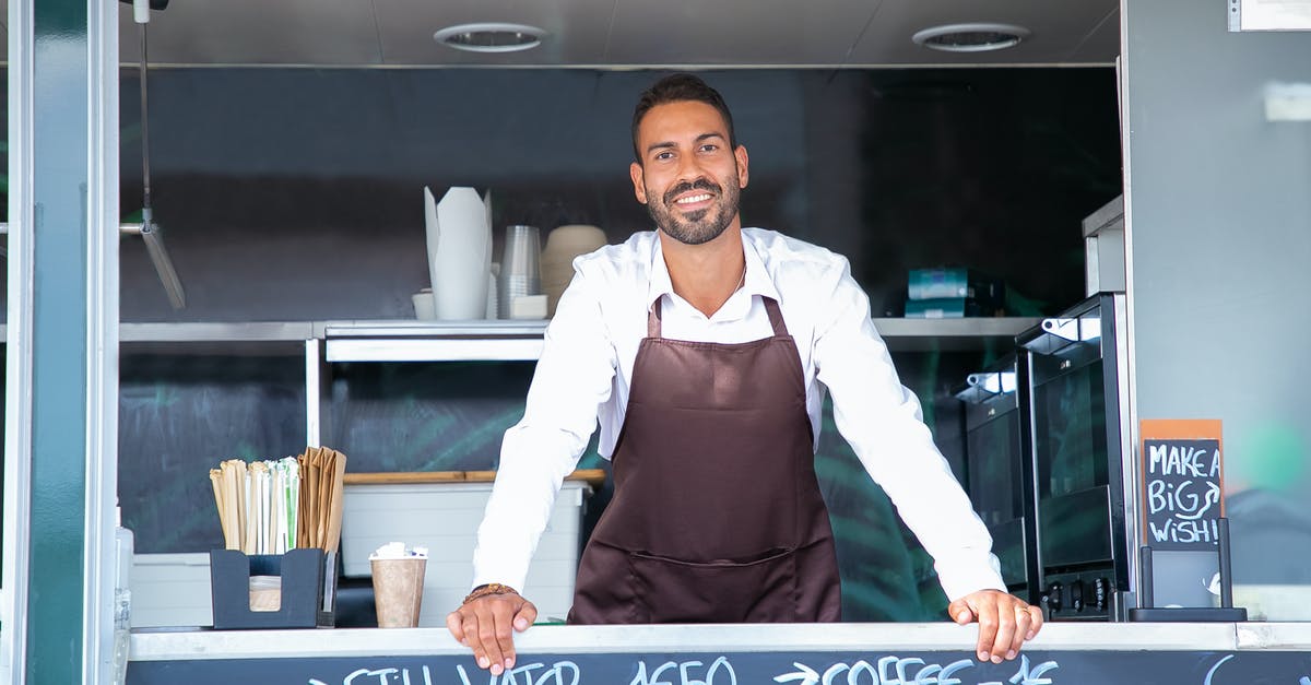 How to make a dedicated server work on a remote server without a GPU? - Good looking young waiter in apron standing at modern food truck counter and looking at camera with toothy smile