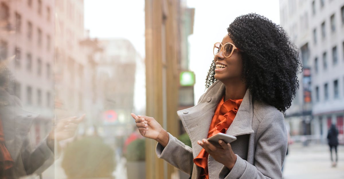 How to make a dwarf satisfied at work? - Happy black woman laughing on street