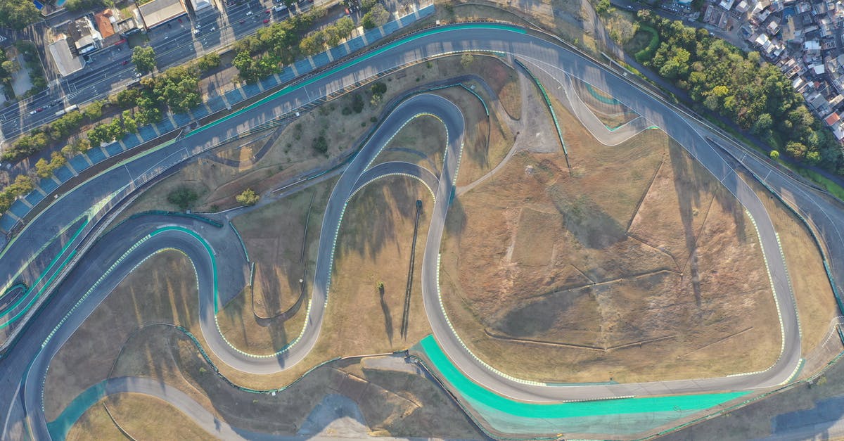 How to make a large area air [duplicate] - Aerial view of long asphalt roadway with sharp turns in modern city at daylight