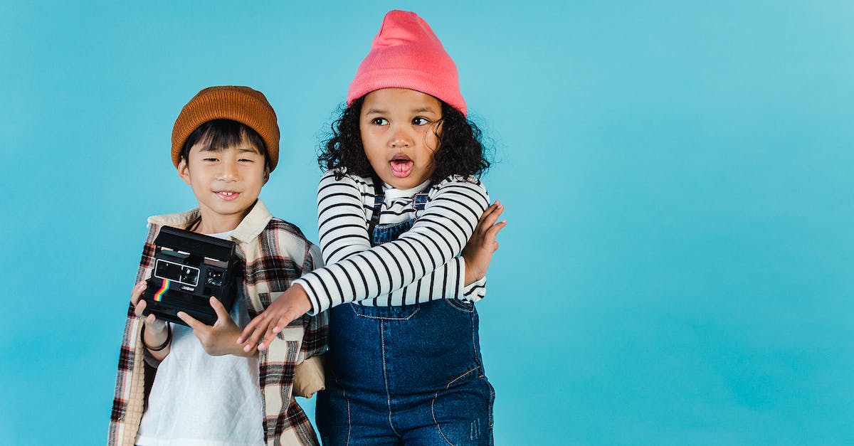 How to make a little money, fast? [duplicate] - Little multiethnic friends with retro photo camera standing together