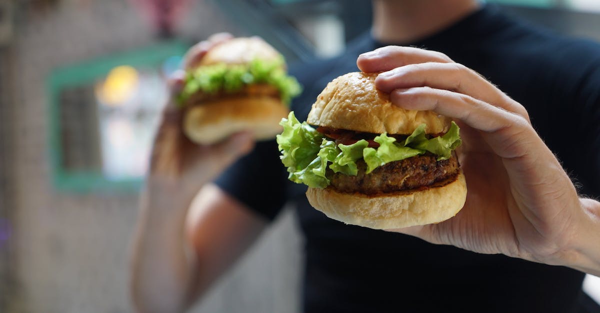 How to make a profitable fast food shop? - Person Holding Two Hamburgers