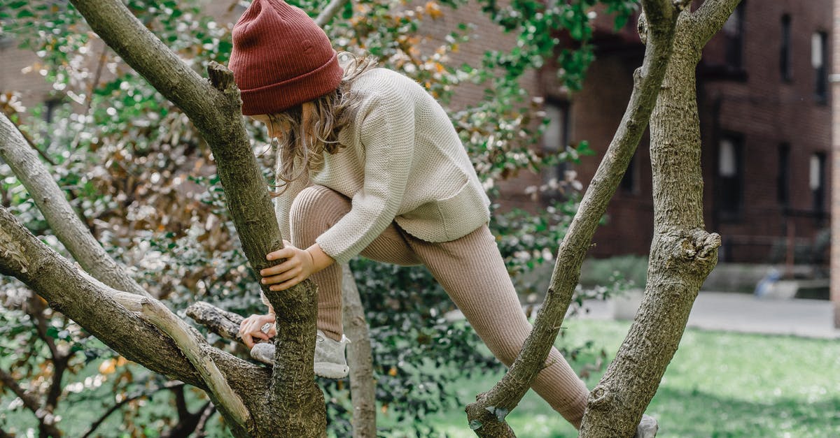 How to make fearless deadly stoic volatile prisoners do their time? - Active girl climbing tree on street