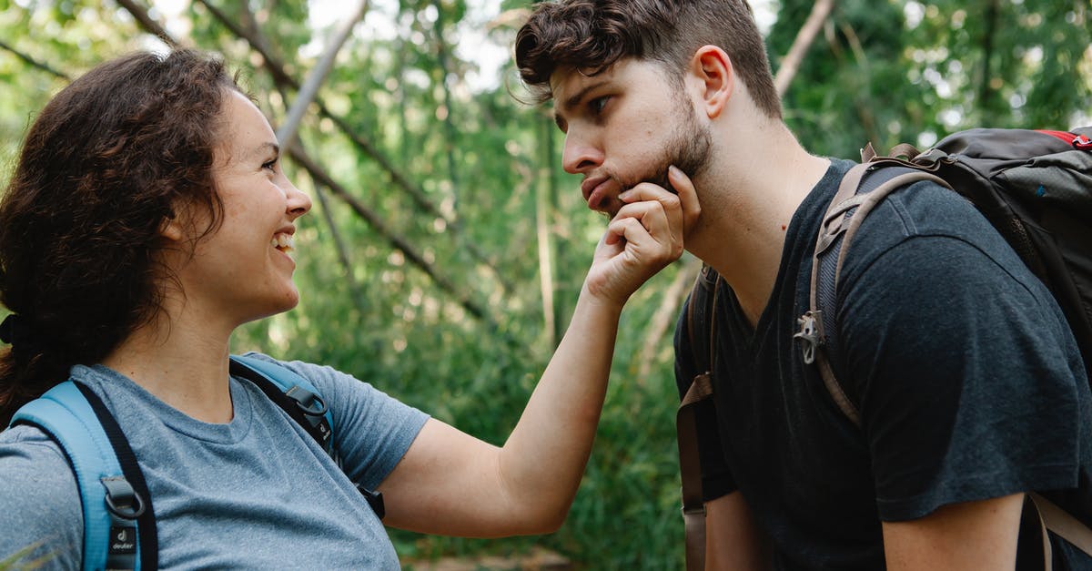 How to make mobs attack each other in Minecraft - Side view of happy young woman smiling and touching face of tired boyfriend making grimace while standing together in green forest during hiking trip How to make mobs attack each other in Minecraft - Side view of happy young woman smiling and touching face of tired boyfriend making grimace while standing together in green forest during hiking trip