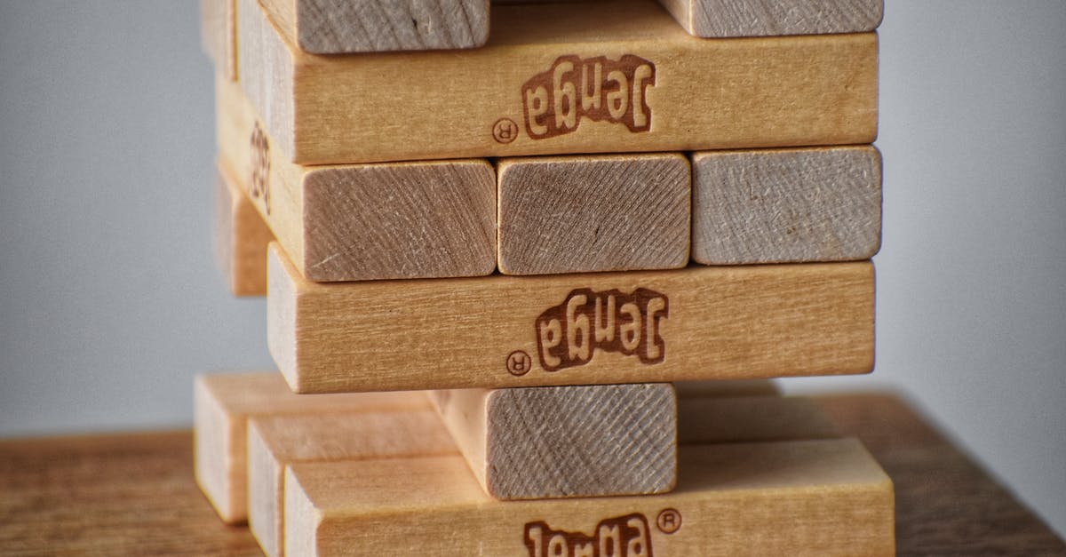 How to merge item stacks? - Closeup of wooden blocks placed on top of each other for playing board game
