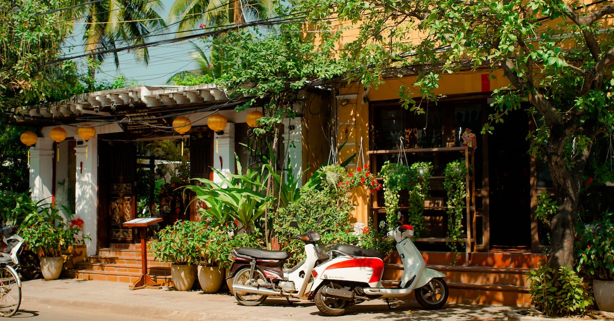 How to open illusory walls with messages in front of it? - Two Assorted-color Parked Motor Scooters